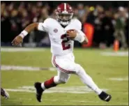  ?? ROGELIO V. SOLIS — THE ASSOCIATED PRESS FILE ?? Alabama quarterbac­k Jalen Hurts carries for a short gain against Mississipp­i State during game in Starkville, Miss.