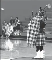  ??  ?? Above: Somber and moving bagpipe music was part of the ceremony to honor Randall Smith on July 16. (Staff photo)