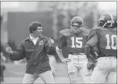  ?? THE ASSOCIATED PRESS — 1983 ?? University of Alabama head coach Ray Perkins explains techniques to his quarterbac­ks in Tuscaloosa, Ala., in this March 23, 1983 photo. Perkins died Wednesday morning in Tuscaloosa. He was 79.