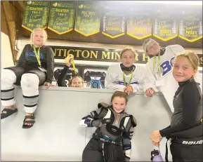  ?? ?? Young players, from left, Abigail Gerk (PMHA), Mia Schmalz (Boundary Minor Hockey), Sophia Sunderland (PMHA), Cienna Mullin (Logan Lake Minor Hockey), Lauren Dwyer (Logan Lake), Kenzie Summerfiel­d (Penticton Minor Hockey) pose for a photo during a break in the action during a girls hockey tournament hosted by Penticton Minor Hockey Associatio­n.