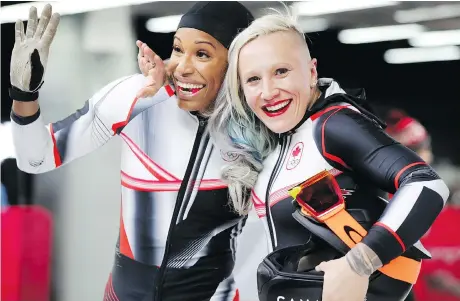  ?? ALEXANDER HASSENSTEI­N/GETTY IMAGES ?? Phylicia George of Markham, Ont., left, and Calgary’s Kaillie Humphries celebrate in the finish area during the two-woman bobsled event at the Olympic Sliding Centre. George and Humphries rallied over the final two races to earn the bronze medal.