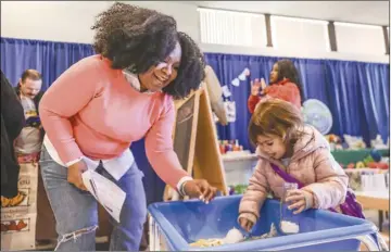  ?? ?? Chris Torres/ The Signal Malena Jackson, the My Preschool Fair coordinato­r, plays with Victoria Vaquero, 3, at the fair. Jackson said that after the pandemic threw a wrench into hosting the fair, she is hoping to have it return to being an annual event for families to learn more about the child care resources that are available in the Santa Clarita Valley.