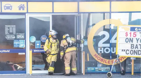  ??  ?? HOT PROPERTY: A Lithium battery exploded at Battery World in James Street and started a small fire. Picture: Nev Madsen.