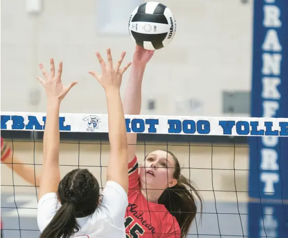  ?? MICHAEL GARD/POST-TRIBUNE PHOTOS
BELOW: ?? ABOVE: Andrean’s Audrey Nohos, right, sends the ball over the net during the Class 2A Frankfort Semistate against Wapahani on Saturday. Andrean’s Marin Sanchez sends the ball over the net.