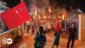  ??  ?? Protesters hold firelight as they join in nationwide night protest against the coup in Khin Oo, Sagaing region, on March 13