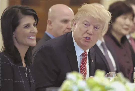 ?? AP PHOTO ?? GATHERING SUPPORT: President Trump, center, attends a working lunch with ambassador­s from member countries of the United Nations Security Council. At left is U.S. Ambassador to the U.N. Nikki Haley.