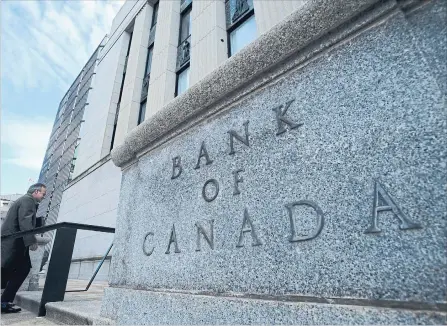  ?? SEAN KILPATRICK
THE CANADIAN PRESS ?? Bank of Canada governor Stephen Poloz returns to his bank after a news conference in Ottawa. The bank is on a rate-hiking path to prevent inflation from climbing too high.