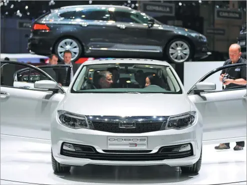  ?? PHOTOS PROVIDED TO CHINA DAILY ?? The Qoros 3 sedan, produced by Qoros Automotive, a joint venture between Chery Automobile and Quantum, is seen on display on an auto show in Geneva, Switzerlan­d.