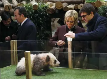  ?? PHOTO/THIBAULT CAMUS, POOL ?? French First lady Brigitte Macron attends a naming ceremony of the panda born at the Beauval Zoo, with Rodolphe Delord, director of the zoo, in SaintAigna­n-sur-Cher, France on Monday. The 4-month-old cub is called Yuan Meng, which means “the...