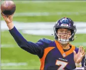  ?? Danny Karnik The Associated Press ?? Quarterbac­k Drew Lock brings the Broncos into Allegiant Stadium to face the Raiders on Sunday.