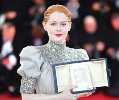  ?? AFP ?? British actress Emily Beecham poses with her trophy after she won the Best Actress Prize for her part in LittleJoe during the closing ceremony of the 72nd edition of the Cannes Film Festival in Cannes.
