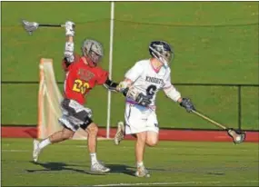  ?? PETE BANNAN — DIGITAL FIRST MEDIA ?? West Chester East’s Jack Pheln (28) takes a big swing as he tries to whack the ball away from West Chester Rustin’s Timmy Durant (6) Tuesday evening. East went on to win, 12-6.