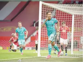  ?? — Reuters ?? Liverpool’s Roberto Firmino celebrates scoring their second goal against Manchester United at Old Trafford.