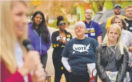  ?? Hyoung Chang, The Denver Post ?? Volunteers gather in front of the SIEU Jeffco Headquarte­rs to kick off a voter canvas for Democratic Colorado state Senate candidates on Saturday.