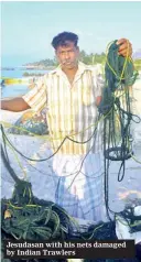  ??  ?? Jesudasan with his nets damaged by Indian Trawlers