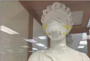  ?? DAVID ALLEN — STAFF ?? The Goddess Pomona statue was masked for 15months to demonstrat­e safe health habits at the shuttered Pomona Public Library. Her mask was removed before Tuesday’s reopening.