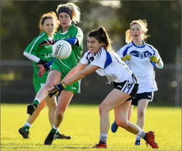  ??  ?? Kellie Kearney launching a Leinster attack despite the best efforts of Connacht’s Joanne Cregg in their inter-provincial clash in Kinnegad, Co. Westmeath, last November.