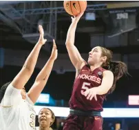  ?? ALLISON LEE ISLEY/THE WINSTON-SALEM JOURNAL VIA AP ?? Virginia Tech guard Georgia Amoore shoots over Wake Forest guard Alexandria Scruggs during the first half Thursday night in Winston-Salem, North Carolina.