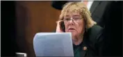  ?? ERIN SCHAFF — THE NEW YORK TIMES ?? Rep. Zoe Lofgren, D-San Jose, reviews the articles of impeachmen­t before they are announced on Capitol Hill in Washington on Dec. 10.