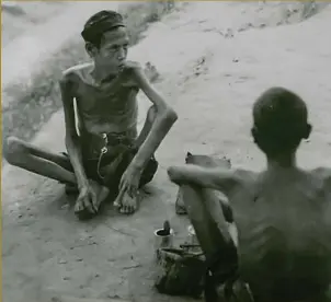  ??  ?? Romusha in Sumatra after their liberation. An estimated 80,000 of these Javanese labourers died during the constructi­on of the railway, and lie in unmarked graves along the route of the track