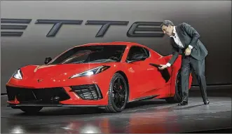  ?? KEVORK DJANSEZIAN / GETTY IMAGES ?? Mark Reuss, president of General Motors Company, unveils the 2020 mid-engine C8 Corvette Stingray during a news conference on July 18 in Tustin, California.