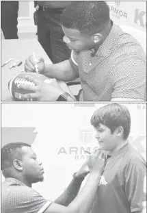  ?? Fred Conley • Times-Herald ?? In the top photo, Arkansas Razorback KJ Jefferson signs one of many footballs at Thursday's meet and greet held at Armor Bank in Forrest City. Besides footballs, Jefferson autographe­d posters of himself, helmets and many other items. Jefferson also signed shirts worn by the Razorback fans who attended the event.