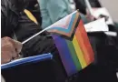  ?? ?? People hold pride flags in support of LGBTQ rights during a news conference Tuesday.