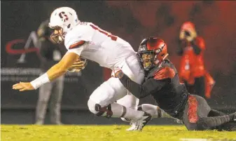  ?? Hayne Palmour IV / San Diego Tribune / TNS ?? San Diego State’s Kameron Kelly sacks Stanford’s Keller Chryst on Saturday night. Chryst went 8-for-19 with two intercepti­ons and a lost fumble in the Cardinal’s 20-17 loss.