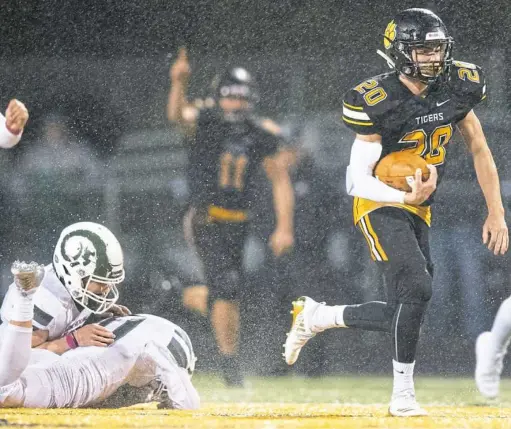  ?? Steph Chambers/Post-Gazette ?? North Allegheny’s Ben Maenza rushes for a touchdown against Pine-Richland Friday night at North Allegheny’s Newman Stadium. North Allegheny beat Pine-Richland, 27-7.
