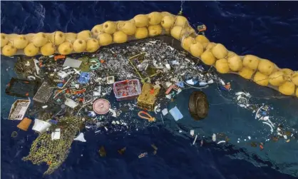  ?? ?? Plastic retained in front of an extended cork line put in by The Ocean Cleanup. Photograph: AP