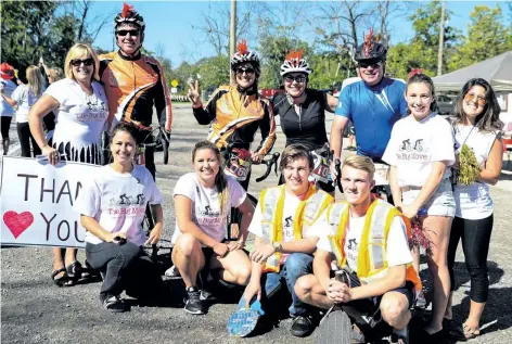  ?? SUPPLIED PHOTO ?? Shown are members of Team Julie/CMH Sales & Leasing participat­ing in the 2016 Big Move Cancer Ride, including Kim Deamude holding the sign at the left, and Annie Fortier-Engs, wearing black in back row.