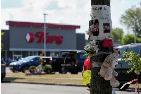  ?? ?? A memorial at the Tops Friendly Market in Buffalo, New York, where a white supremacis­t killed 10 Black people on 14 May. Photograph: Reuters