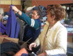  ?? PETE BANNAN – DIGITAL FIRST MEDIA ?? Barclay Friends senior home nurse Keri Foreman, left, looks for warm clothing for 100- year- old Helen Carey. Next to Foreman is Peg Hoffman of Exton, who is Carey’s daughter. “My mom is OK,” she said. “Keri, and the staff at Barclay’s is so wonderful....