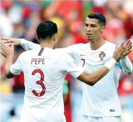  ?? –Reuters ?? CONGRATULA­TIONS: Portugal’s Cristiano Ronaldo and Pepe celebrate after the match.