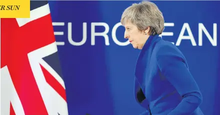  ?? EMMANUEL DUNAND / AFP / GETTY IMAGES ?? U.K. Prime Minister Theresa May leaves after a press conference following a special meeting of the European Council to endorse the draft Brexit agreement in Brussels on Sunday. The European Union’s top official urged British lawmakers to ratify the Brexit deal May has negotiated with European leaders, warning that it will not be modified.