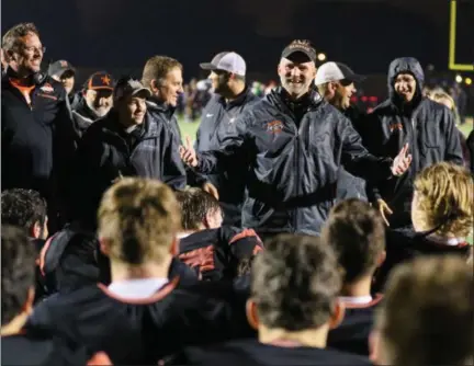  ?? DAVID TURBEN — THE NEWS-HERALD ?? North coach Shawn Dodd addresses his team after a 28-7 win over Chardon on Oct. 27 to clinch the first playoff berth in school history.