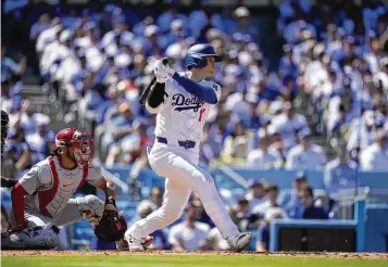  ?? ASSOCIATED PRESS ?? Shohei Ohtani singles in the fifth inning Thursday in the Dodgers’ win against the Cardinals in Los Angeles. It’s not clear how long the gambling investigat­ion involving Ohtani and his former interprete­r will take.