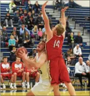  ?? AUSTIN HERTZOG - DIGITAL FIRST MEDIA ?? Methacton’s Jeff Woodward pump-fakes as Owen J. Roberts’ Dawson Stuart (14) leaps during the second half of their PAC playoff game Tuesday at Pottstown.