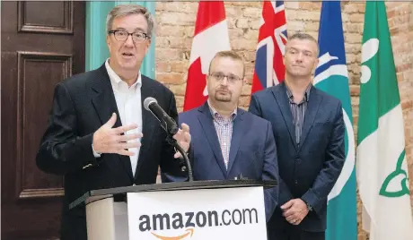  ?? PHOTOS: ERROL MCGIHON ?? Mayor Jim Watson, Cumberland ward Coun. Stephen Blais and Beacon Hill-Cyrville ward Coun. Tim Tierney at Tuesday’s announceme­nt. The proposed Amazon warehouse is expected to create more than 600 permanent jobs.