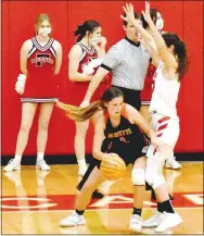  ?? Enterprise-Leader/MARK HUMPHREY ?? Gravette freshman Dalachie Wison backs in with the dribble working on the low-block against Farmington senior Tori Kersey. Despite Wishon’s efforts, the Lady Lions suffered a controvers­ial 72-67 overtime loss with two technicals assessed against the bench during 4A-1 girls basketball action at Farmington on Tuesday, Jan. 19.