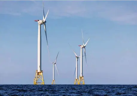  ?? John Moore/Getty Images ?? Wind turbines near Block Island, R.I. The U.S. is on track to sell the first ever offshore wind developmen­t rights in the Gulf of Mexico later this year.