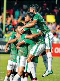  ?? ?? Bangladesh’s players celebrate taking an early lead (Photo courtesy adhadhu.com)