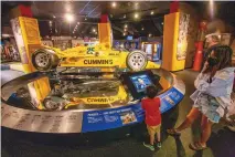  ?? ADOLPHE PIERRE-LOUIS/JOURNAL ?? Desiree Lapahie, right, and her 4-year-old, Avery, were among those attending the birthday celebratio­n for the late Al Unser Sr. at the Unser Racing Museum Sunday. “Big Al” drove to victory in 1987.