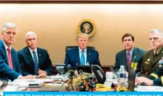  ?? — AFP ?? WASHINGTON: This handout picture taken yesterday shows US President Donald Trump (center) watching in the Situation Room of the White House as US Special Operations forces close in on IS leader Abu Bakr Al-Baghdadi.