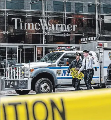  ?? JEENAH MOON NYT ?? Police outside the Time Warner Center in New York after the discovery of an explosive device at the CNN offices, Wednesday. Explosive devices were also sent to Barack Obama and Hillary Clinton, sparking an intense investigat­ion.