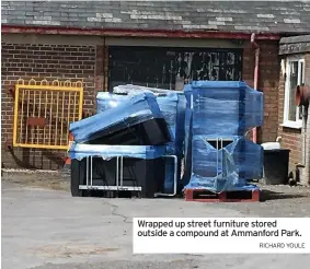  ?? RICHARD YOULE ?? Wrapped up street furniture stored outside a compound at Ammanford Park.