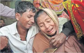  ?? AP ?? Relatives of people killed when unidentifi­ed gunmen attacked a mosque during evening prayers on Thursday grieve before their funeral in Bangladesh’s Bogra district yesterday. Thursday’s attack follows a wave of deadly assaults in 2015 on foreigners,...
