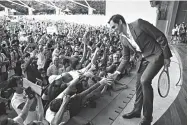  ?? GETTY IMAGES ?? People person: Federer greets fans in 2018