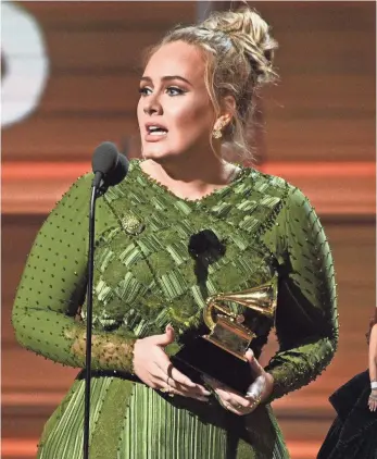  ?? RIHANNA BY DAN MACMEDAN, USA TODAY; PHOTOS BY ROBERT HANASHIRO, USA TODAY ?? Adele scores the biggest awards of the night.