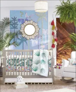  ?? KIM COOK POTTERY BARN KIDS VIA AP ?? A nursery decorated with items that are part of a new collection for Pottery Barn Kids. Bold colours and hand drawn patterns are part of designer and author Justina Blakeney’s signature bohemian style, inspired by her travels and love of nature.